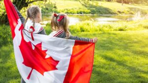 2 kids with Canadian flag
