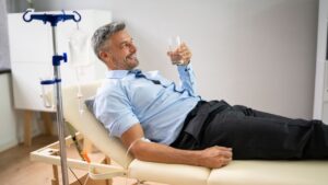 A man having IV drip and therapy